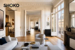 A stunning before-and-after transformation of a Paris Haussmann apartment — original limestone walls and parquet revealed, soaring ceilings, contemporary luxury finishes