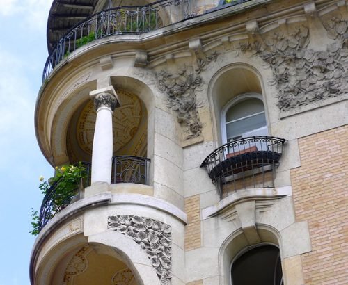 Elegant Paris 16th arrondissement avenue lined with luxury Haussmann buildings